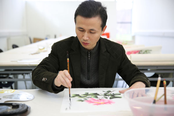 International friendship blossoms in peony painting