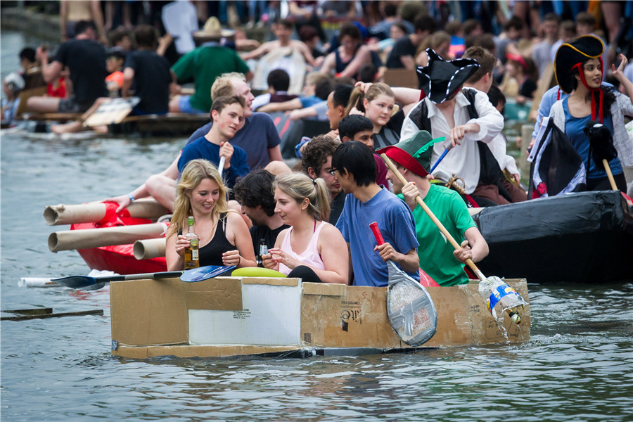 Cambridge students celebrate end of exams with cardboard boat race