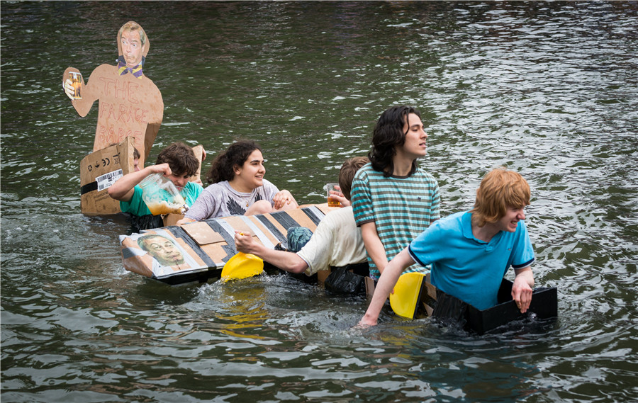 Cambridge students celebrate end of exams with cardboard boat race