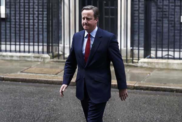 UK's Cameron hums merry tune after announcing PM handover moves