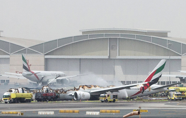 Fire guts Emirates jet after hard landing; 1 firefighter dies