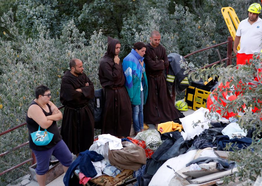 Italy rescuers toil through night as death toll hits nearly 250