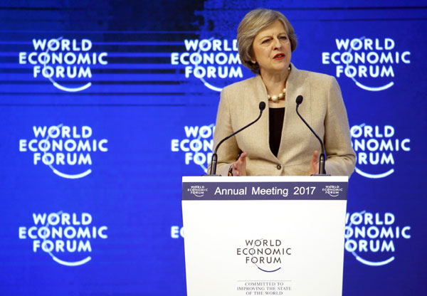 Theresa May tries to dispel Brexit worries at Davos forum