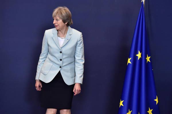 Tight-lipped May fails to halt speculation over 50-bln-euro Brexit deal