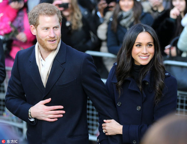 Prince Harry, Meghan Markle greet fans in English city
